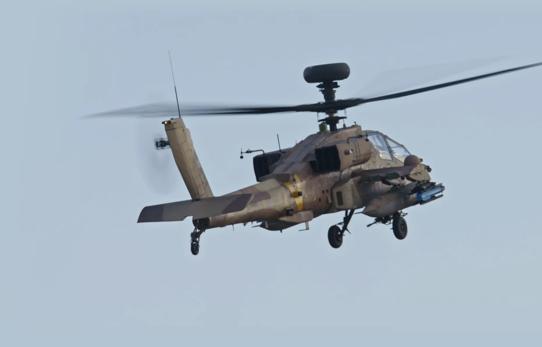 An AH-64 Apache helicopter in flight