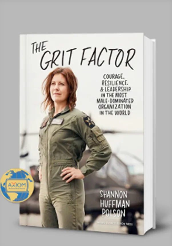 Portrait of a woman in a flight suit with aircraft in the background