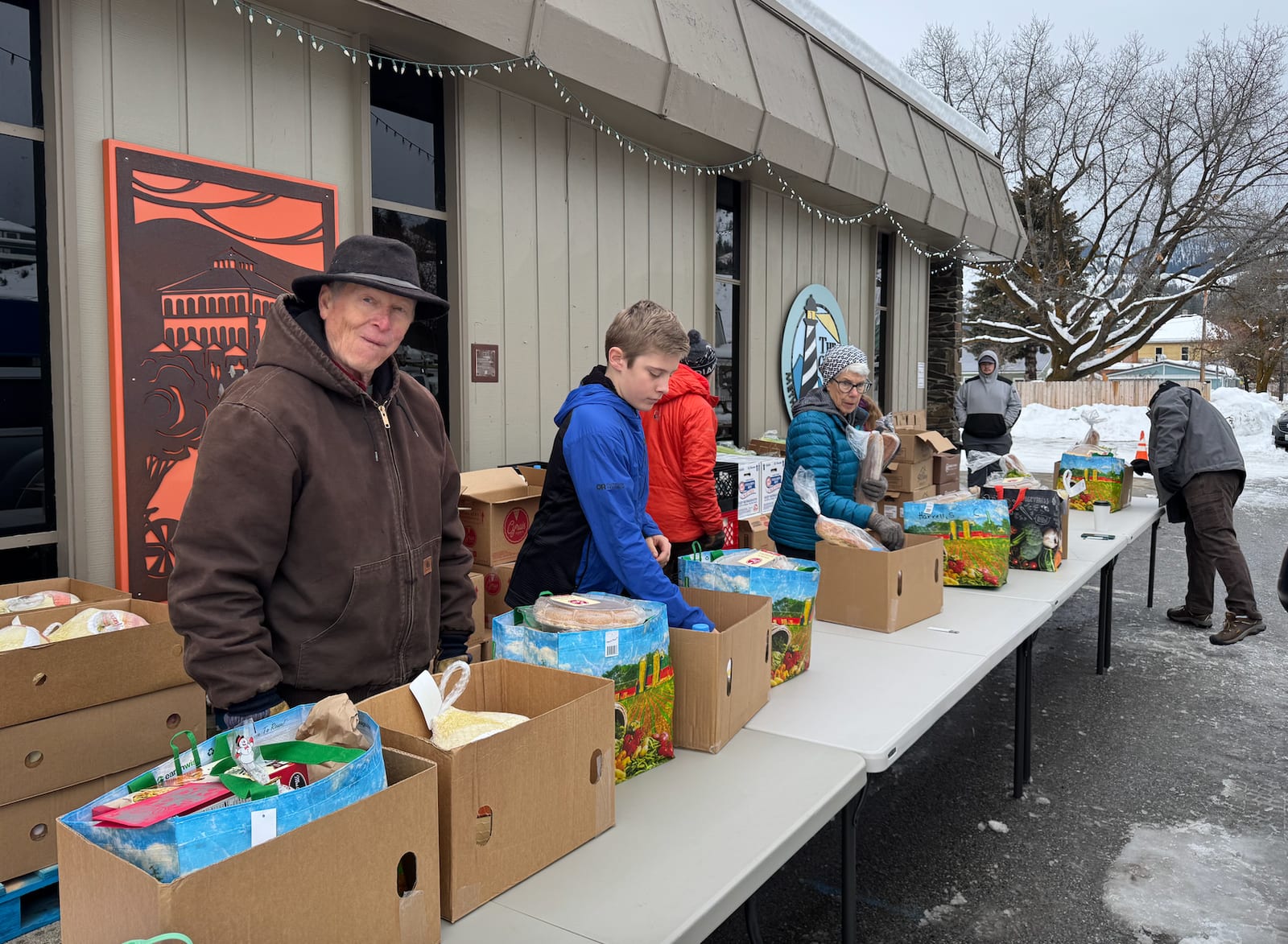 Volunteers packing Christmas meals at a local food bank