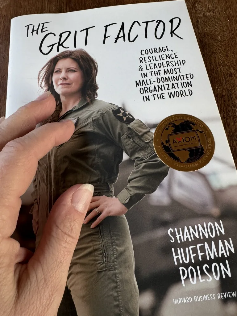 The Grit Factor with its Axiom Business Book Award medal