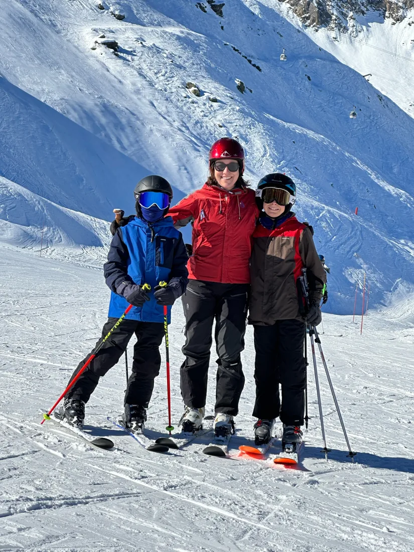 Shannon Huffman Polson skiing with her sons in the mountains